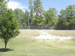 Cut slope behind playground