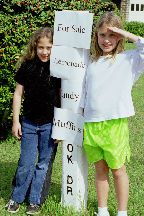 2 girls and sign.jpg